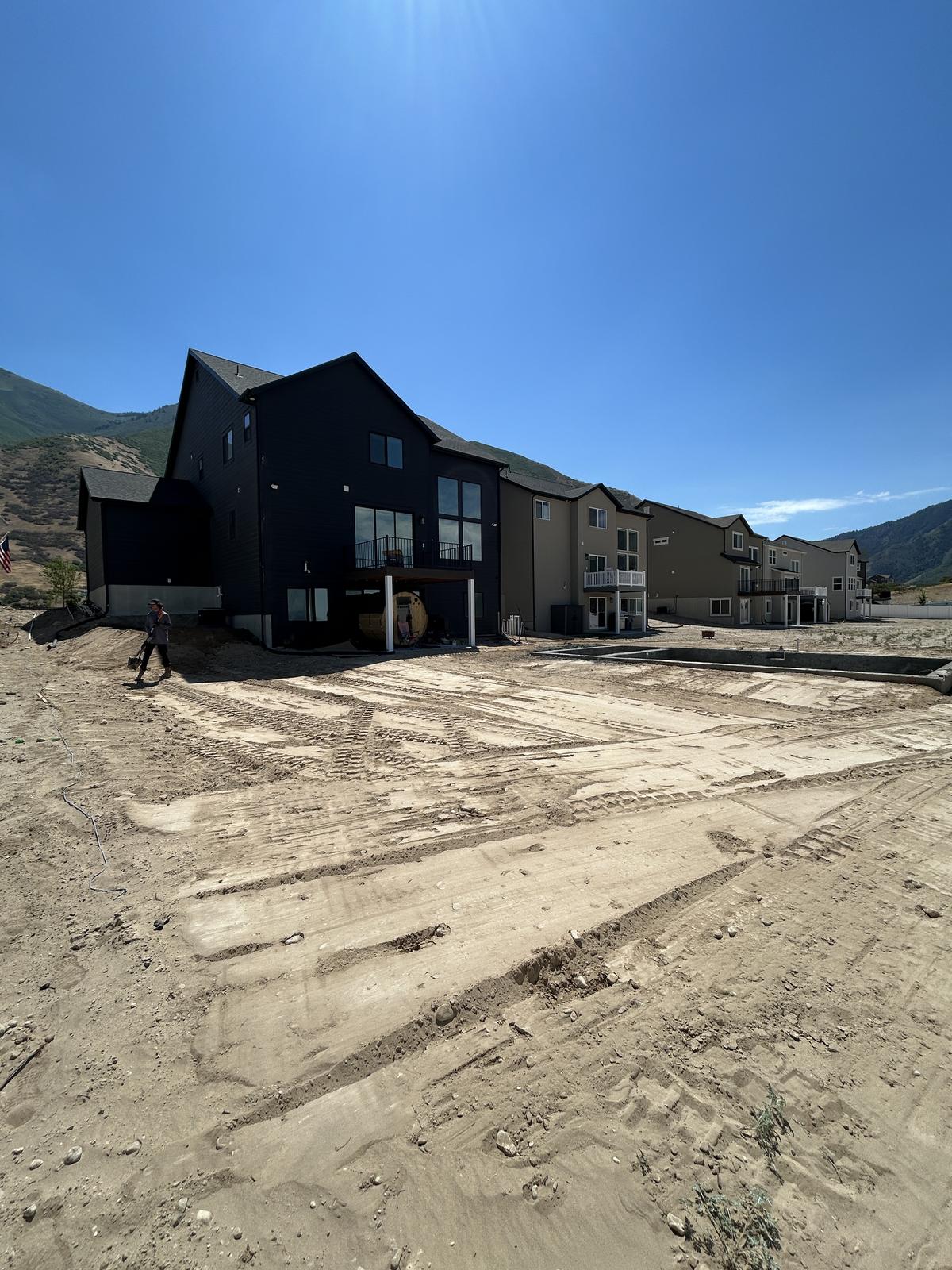 Large backyard graded flat behind new construction homes